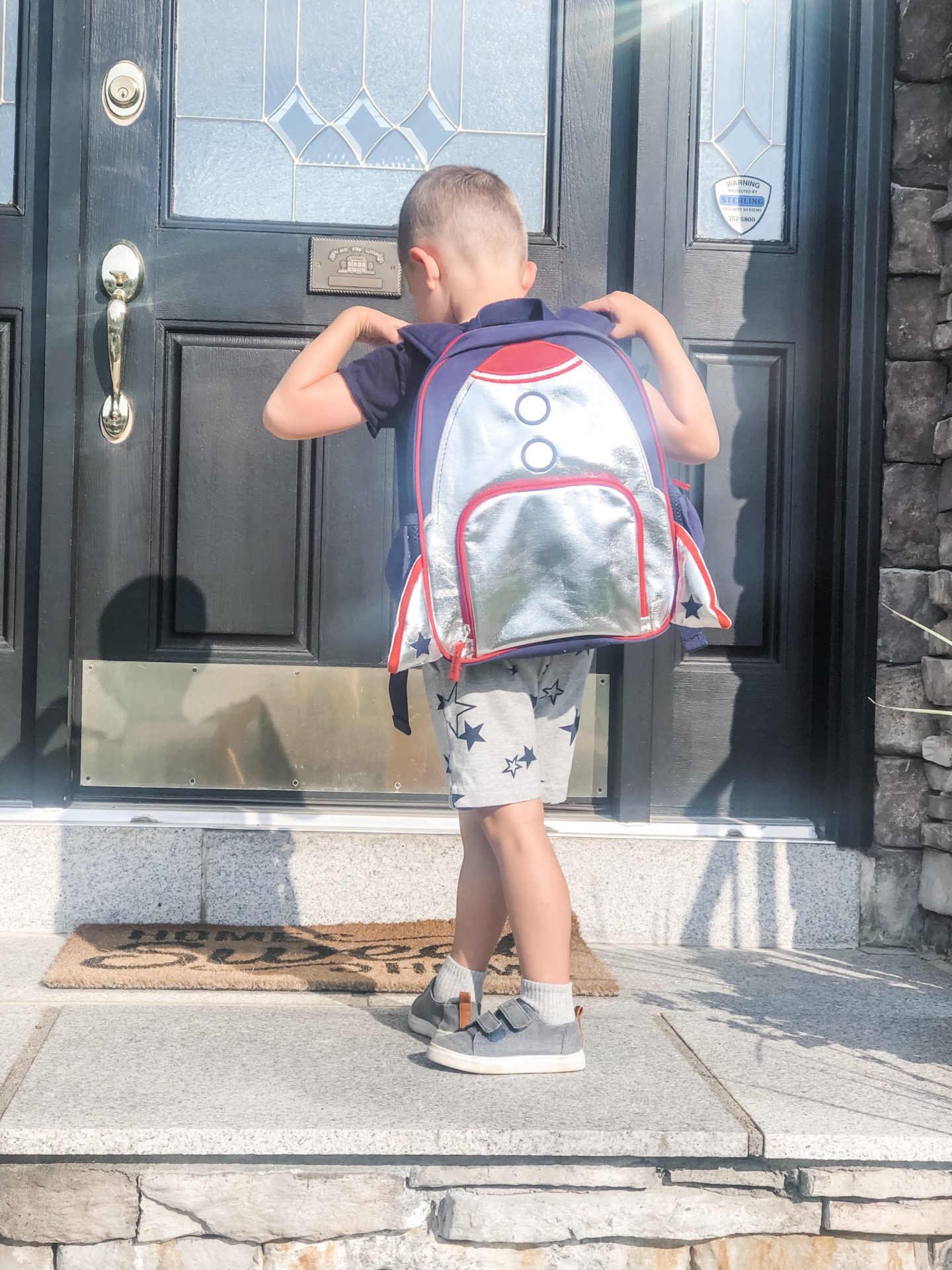 kid wearing his backpack