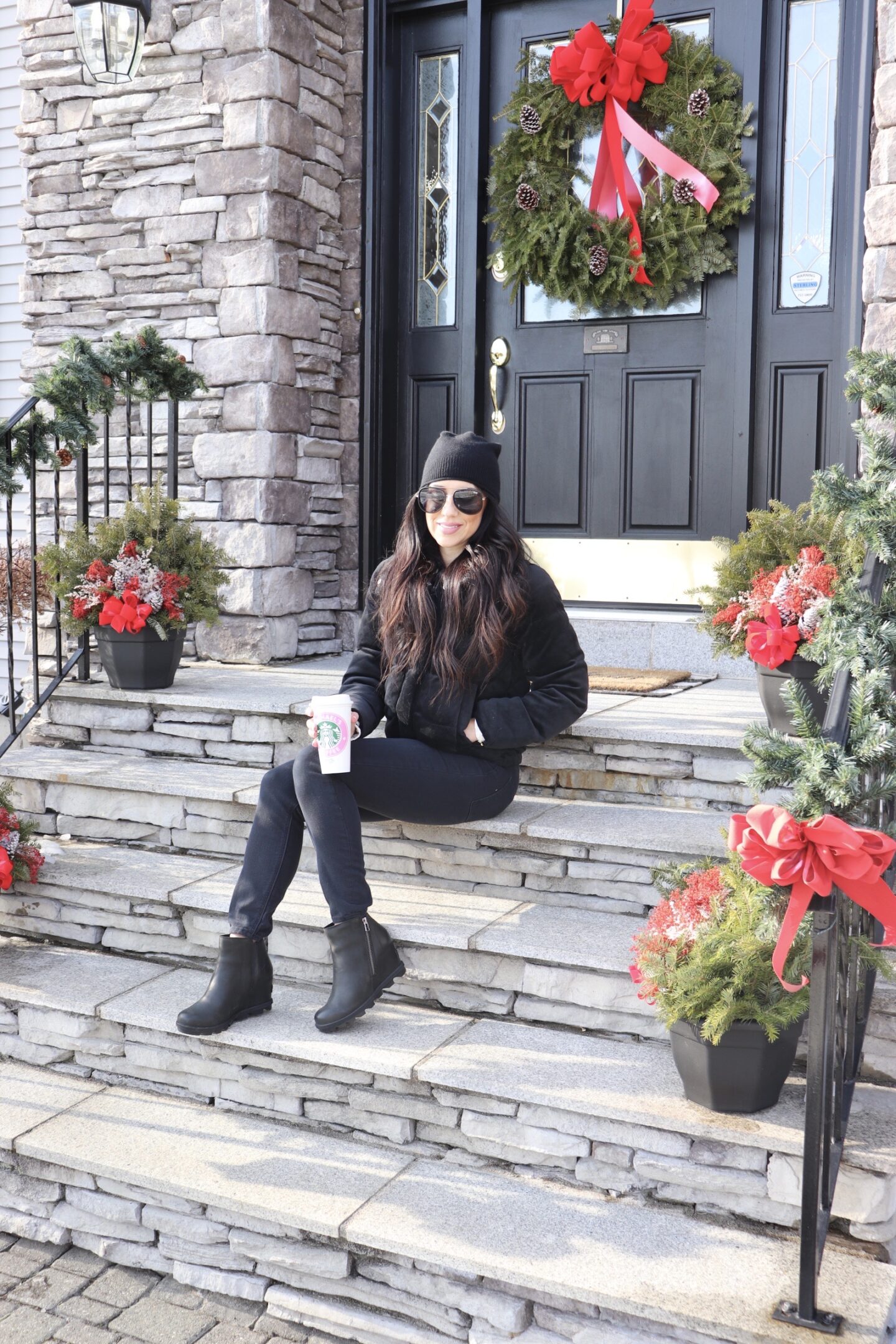 woman sitting outside her porch 