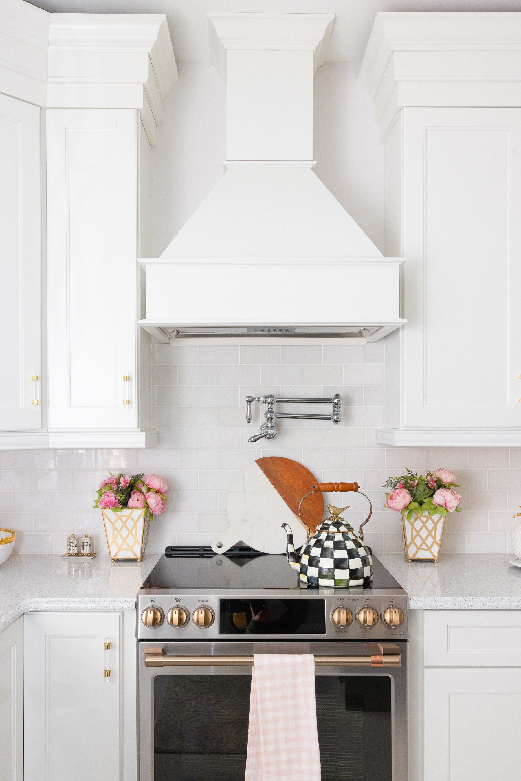 kitchen with white interior, oven, and Quartz Counters