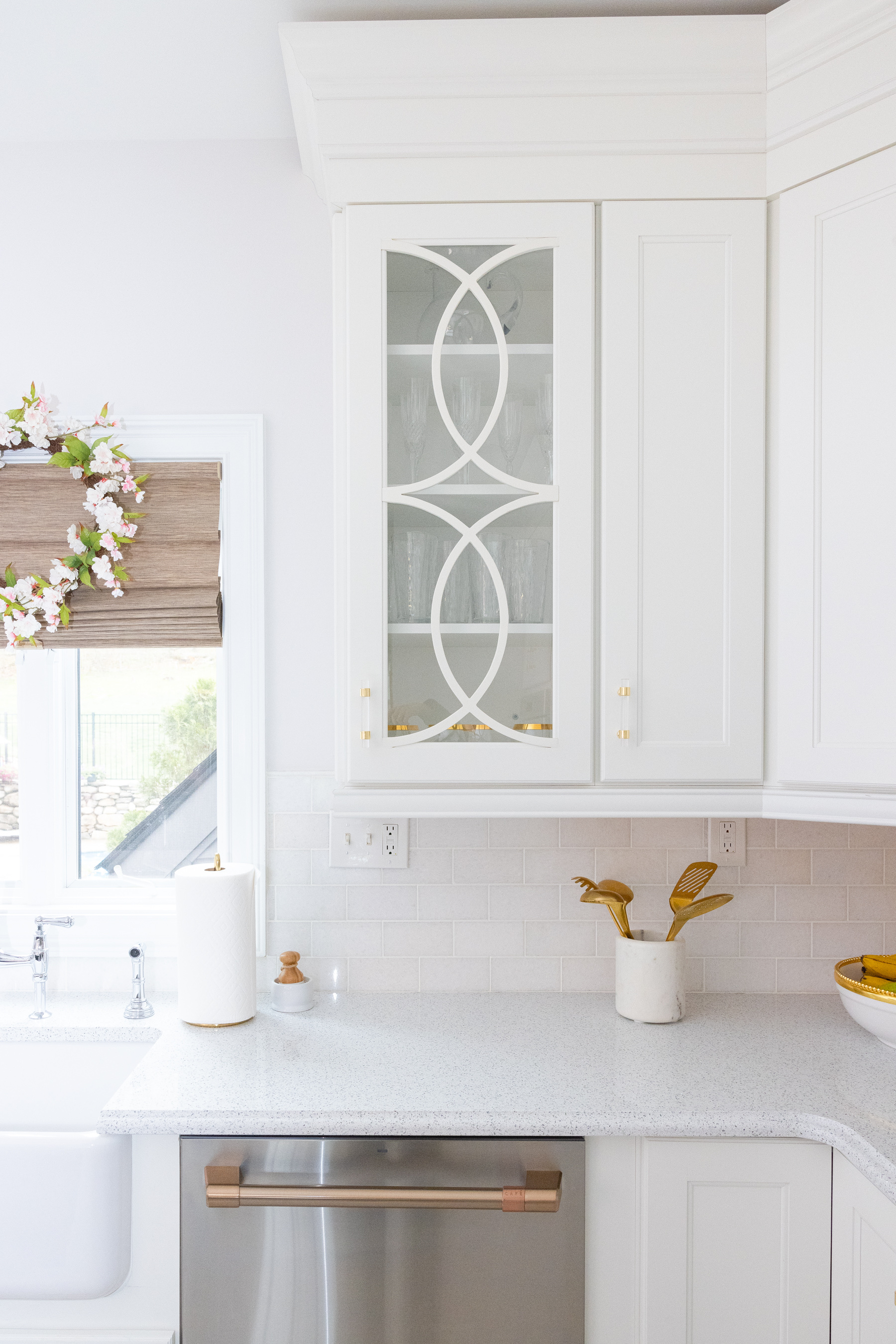 kitchen white cabinets, gold cutleries, and Quartz Counters