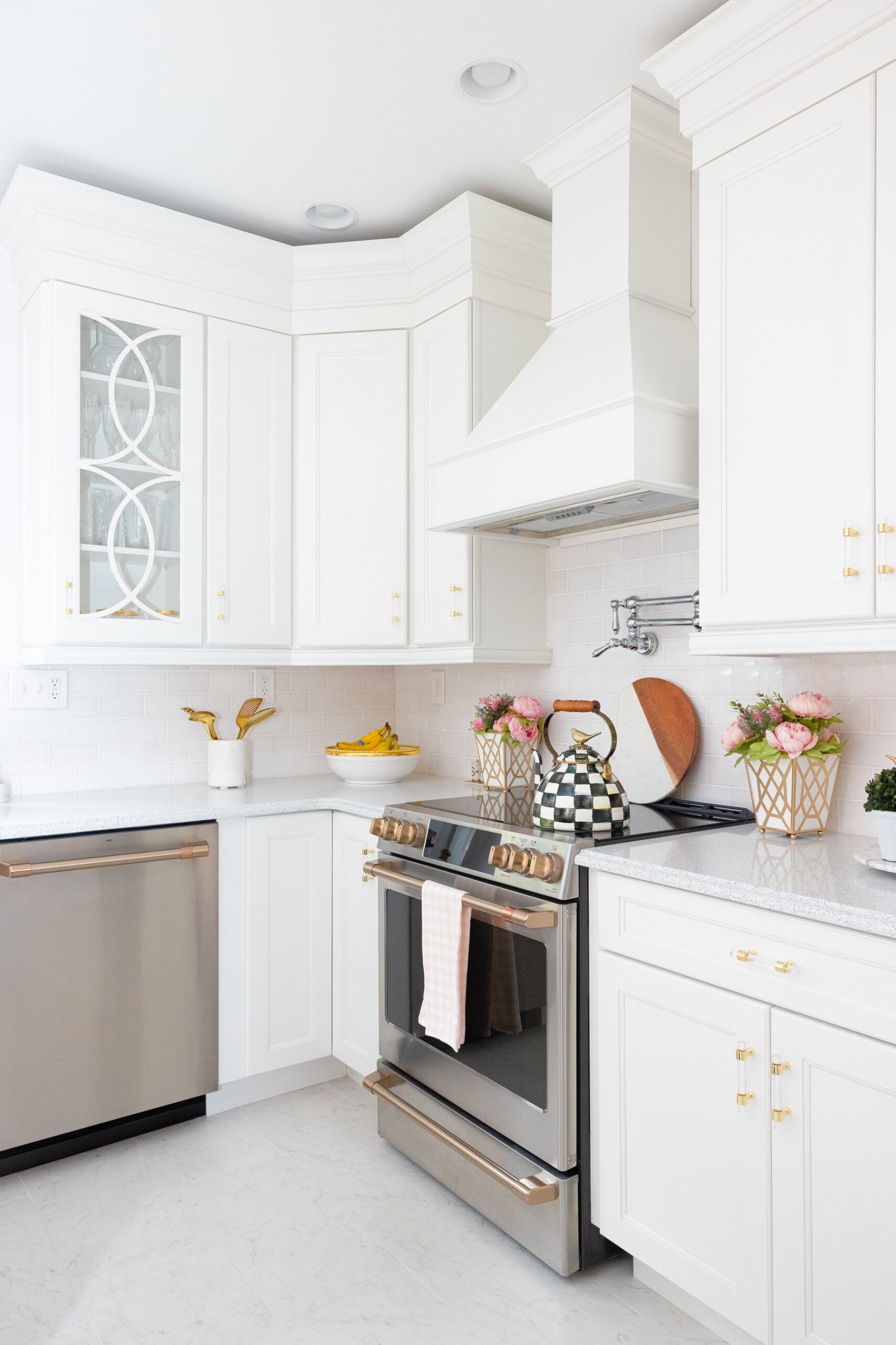 kitchen with white interiors and gold accents