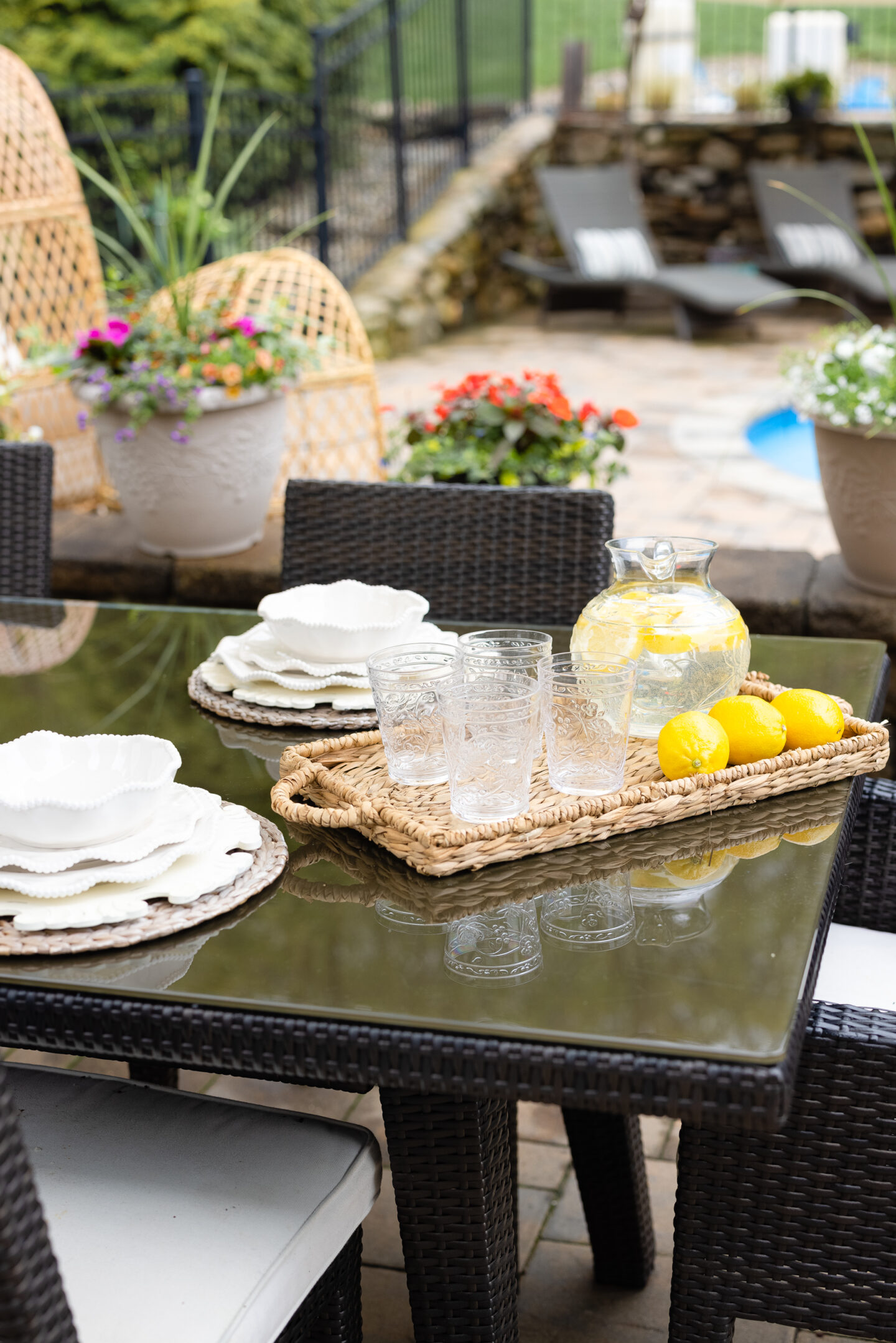 tables and chairs on the poolside