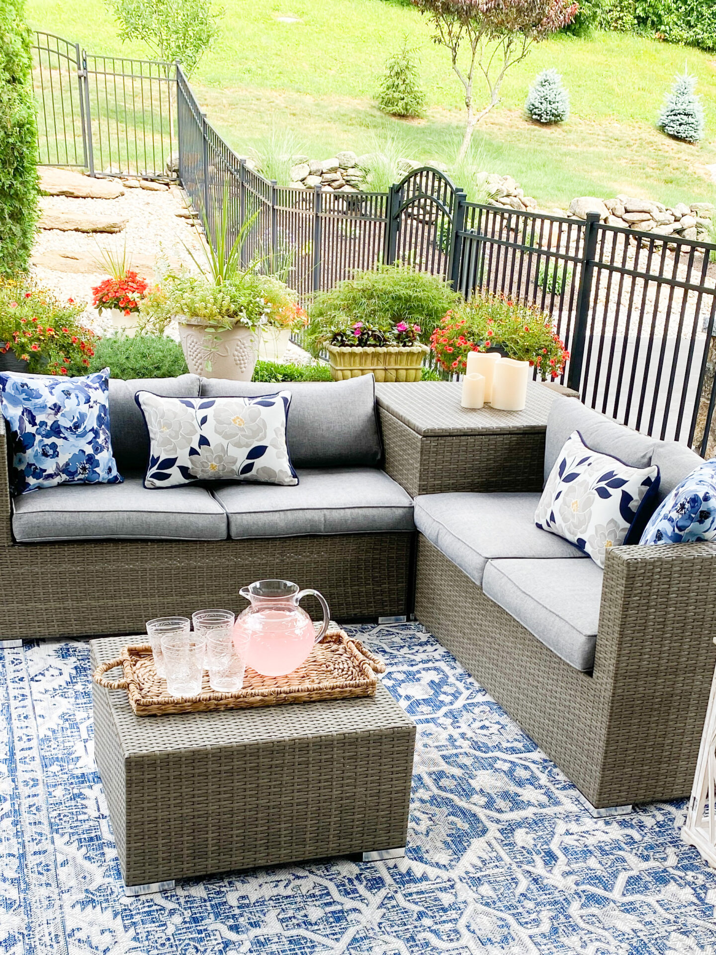 Covered patio reveal with outdoor furniture and juice and glasses on the table 